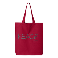 Thumbnail for Tote bag with a confident, beautiful woman with an afro on one side and the word 'Peace' on the other, symbolizing empowerment and harmony