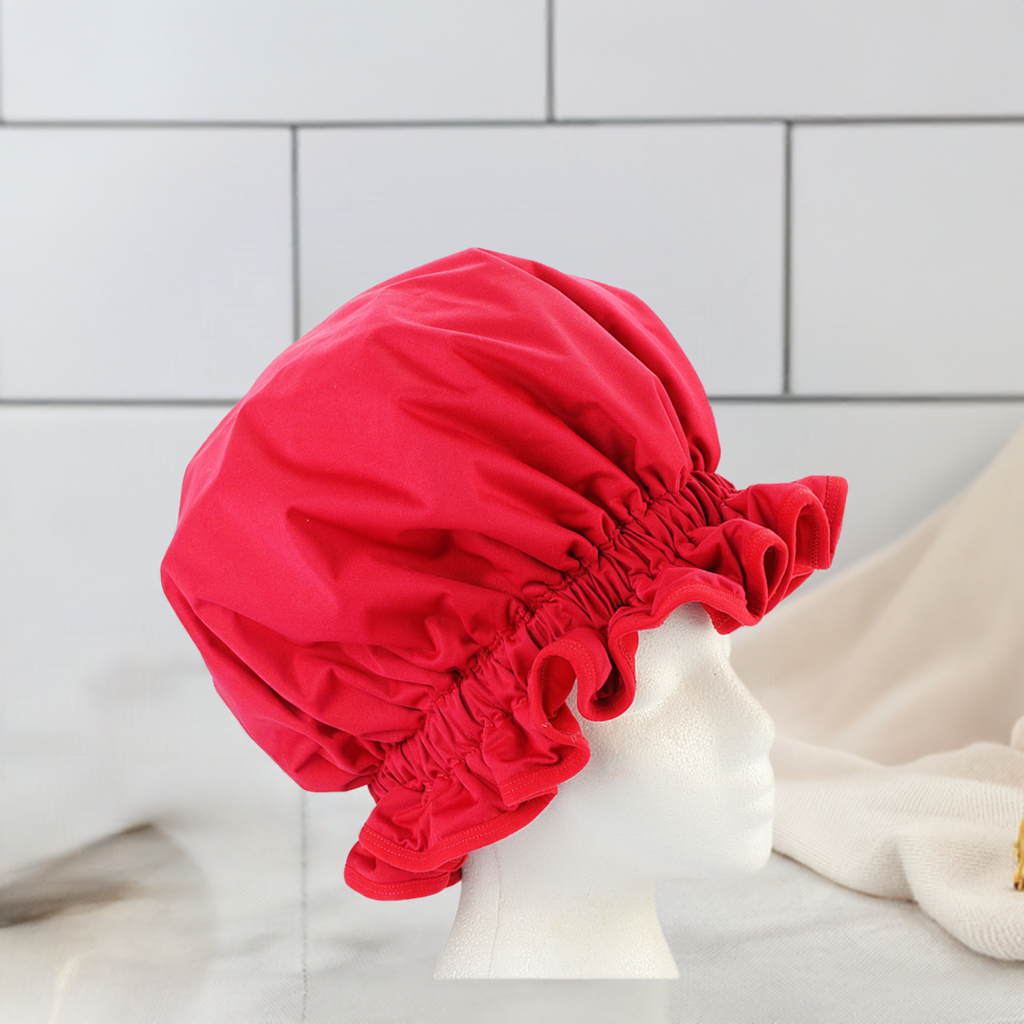 Protect your hairstyle with this washable, frizz-preventative red shower cap. Designed to keep your hair dry and styled, it prevents frizz and helps maintain your look, whether you're showering, sleeping, or just need a quick hair shield. Made with durable, easy-to-clean fabric, this stylish cap is perfect for those who want to protect their hair while keeping their style intact. Ideal for everyday use, it's a must-have accessory for maintaining healthy, frizz-free hair.