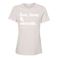 Thumbnail for Embrace positivity and style with the 'Live, Love & Elevate' women’s relaxed fit t-shirt. Made from soft, breathable fabric, this shirt offers both comfort and flair with a flattering, relaxed silhouette. Whether you're out with friends or enjoying a casual day, the inspirational message encourages you to live your best life and elevate your mood. Perfect for pairing with jeans, leggings, or shorts, this versatile tee adds a touch of motivation and style to any wardrobe.